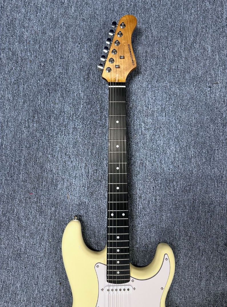 Close-up of the RS-100 roasted maple neck and stainless-steel frets.